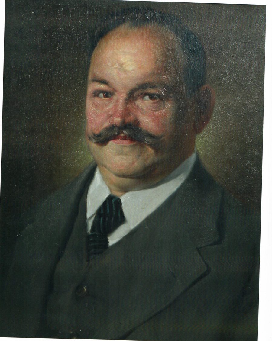 Gemälde von Karl Kustermann, dem Gründer: dunkler Anzug, Stehkragen, gezwirbelter Schnauzbart